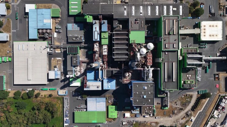 Drone aerial view of a waste incineration plant in Herten, Germany, showing waste-to-energy infrastructure, industrial buildings, chimneys and environmental technology.
