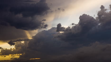 dark clouds moving slowly block the sky above