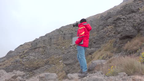 digital nomad man traveling through the mountains