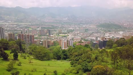 Slow-tilting-aerial-shot-of-city-centre-of-Medellin,-Castropol-Colombia