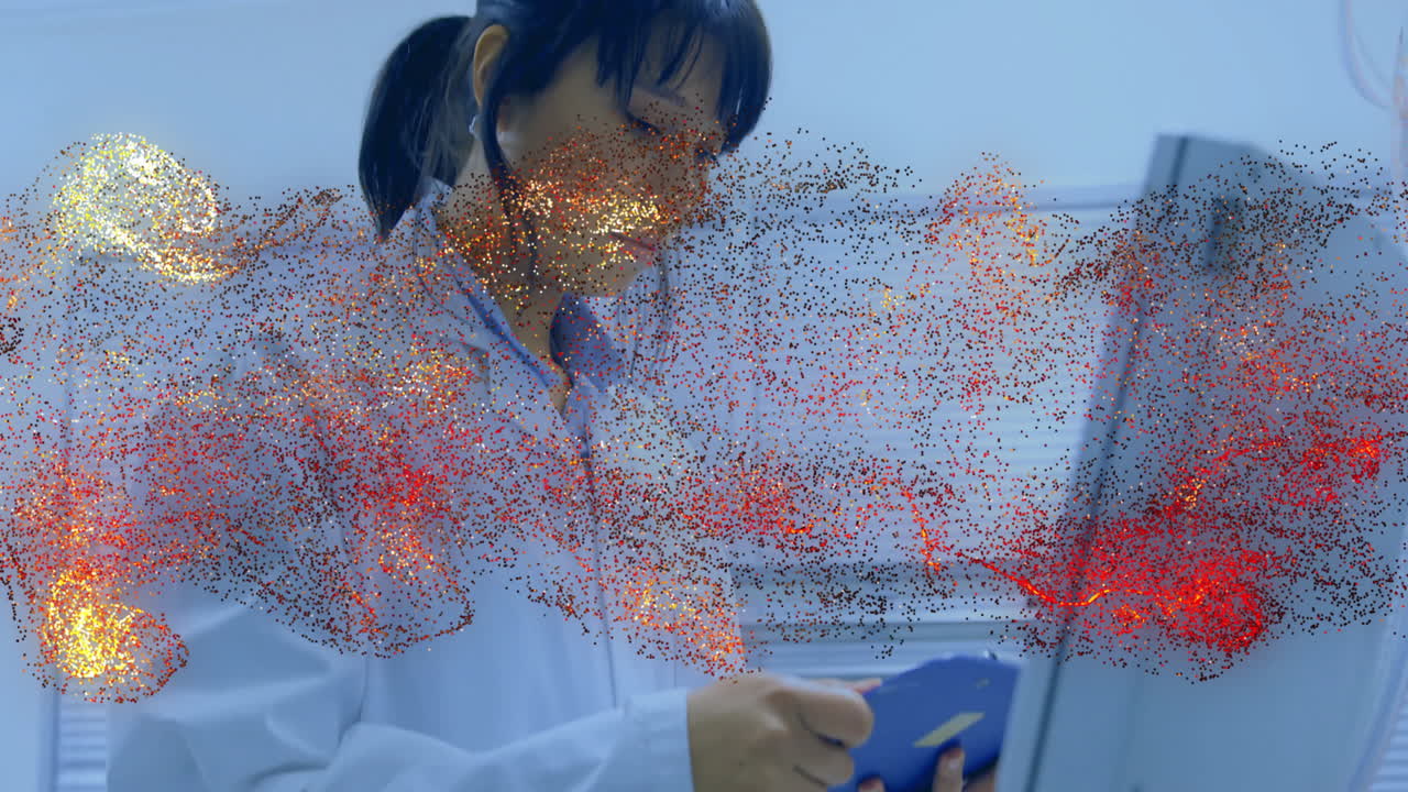 female medical professional using tablet inside clinical lab, displaying red yellow data overlay