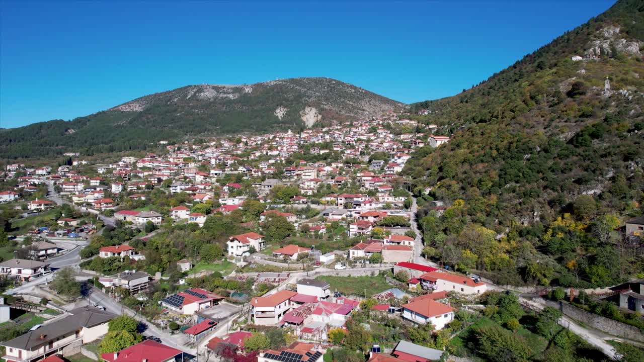 Aerial View of Konitsa Village in Zagorochoria Greece, Drone Dolly Shot Panoramic View of Traditional Town of Epirus Region and Nature