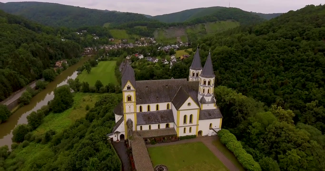Drone Flight above German Monastery. View on river and village.