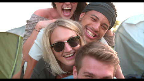 slow motion shot of friends having fun on camping holiday