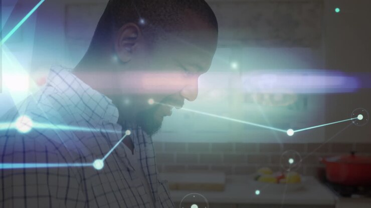 Animation of networks of connections with icons over man using tablet