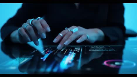 person interacting with a futuristic touchscreen interface