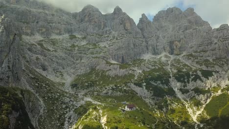 aerial view of drone panning and flying sideways near alpine mountain peaks. video footage with drone stock video