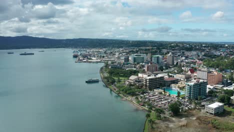 aerial of coastline of capital city suva in fiji with hotels and other buildings