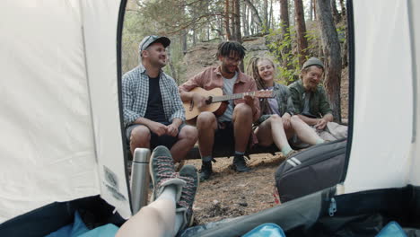 friends camping and making music