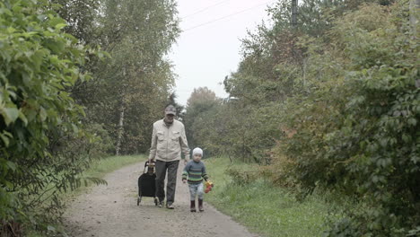 grandad and grandson walking