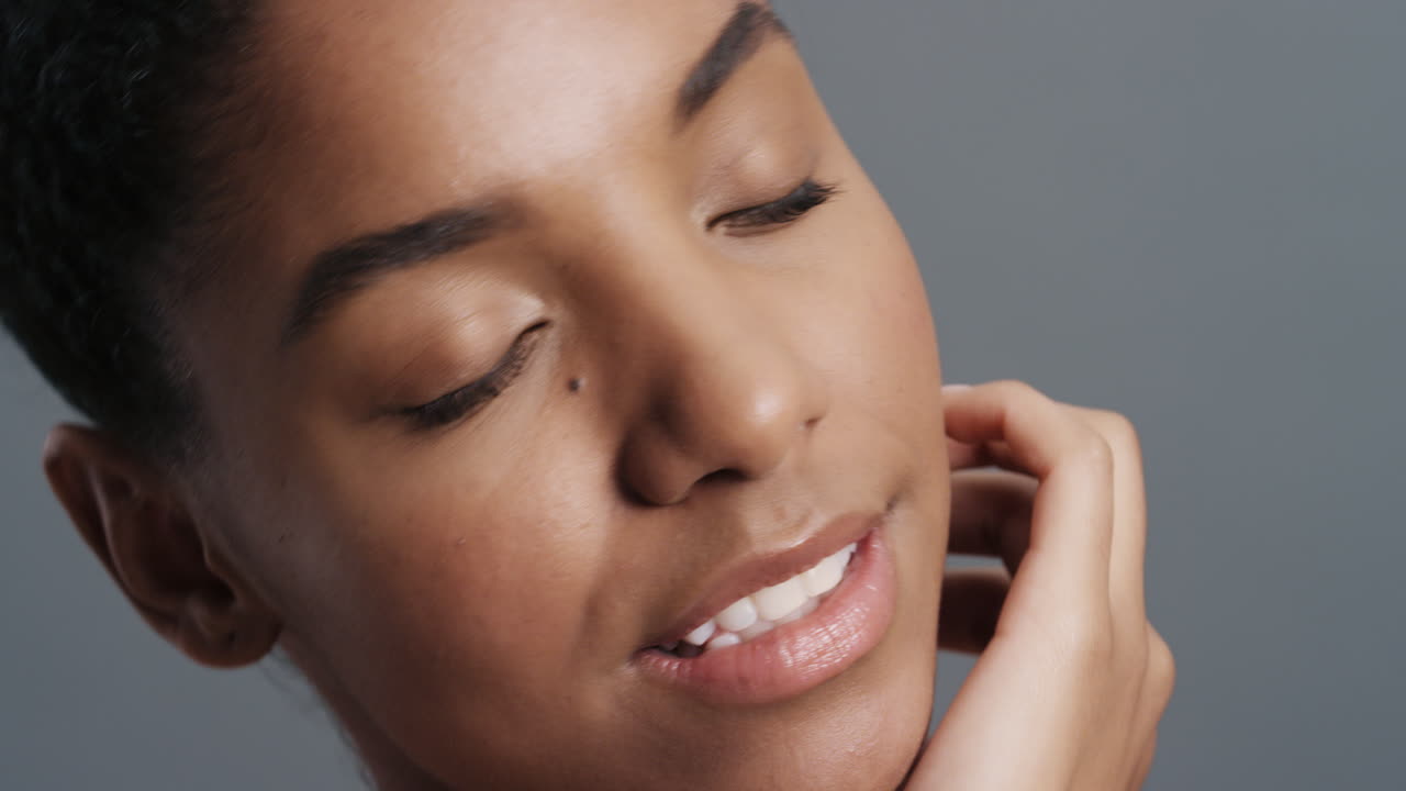 close up portrait gorgeous african american woman gently touching face with hands enjoying smooth healthy skin complexion natural feminine beauty skincare concept