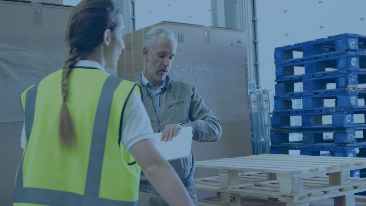 Warehouse supervisor reviewing stock clipboard sparking animated social media icons around coworker