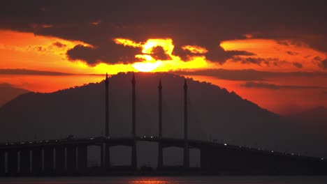 zoom to penang bridge main span with sun