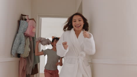 happy-little-asian-girl-playing-catch-with-mother-running-through-house-enjoying-fun-weekend-morning-with-child-4k-footage