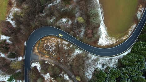 car driving on a beautiful road - top down view