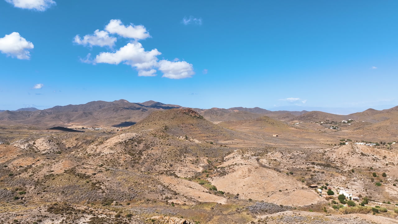 Flight cruises over the dramatic ancient volcanic landscape of Cabo de Gata Nijar National Park, and luxury Spanish farm houses Almeria