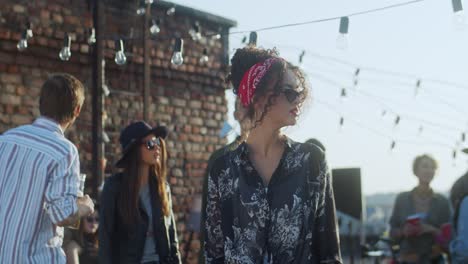 side view of a teenage boy and teenage girl talking standing near of seashore on a cloudy day 1