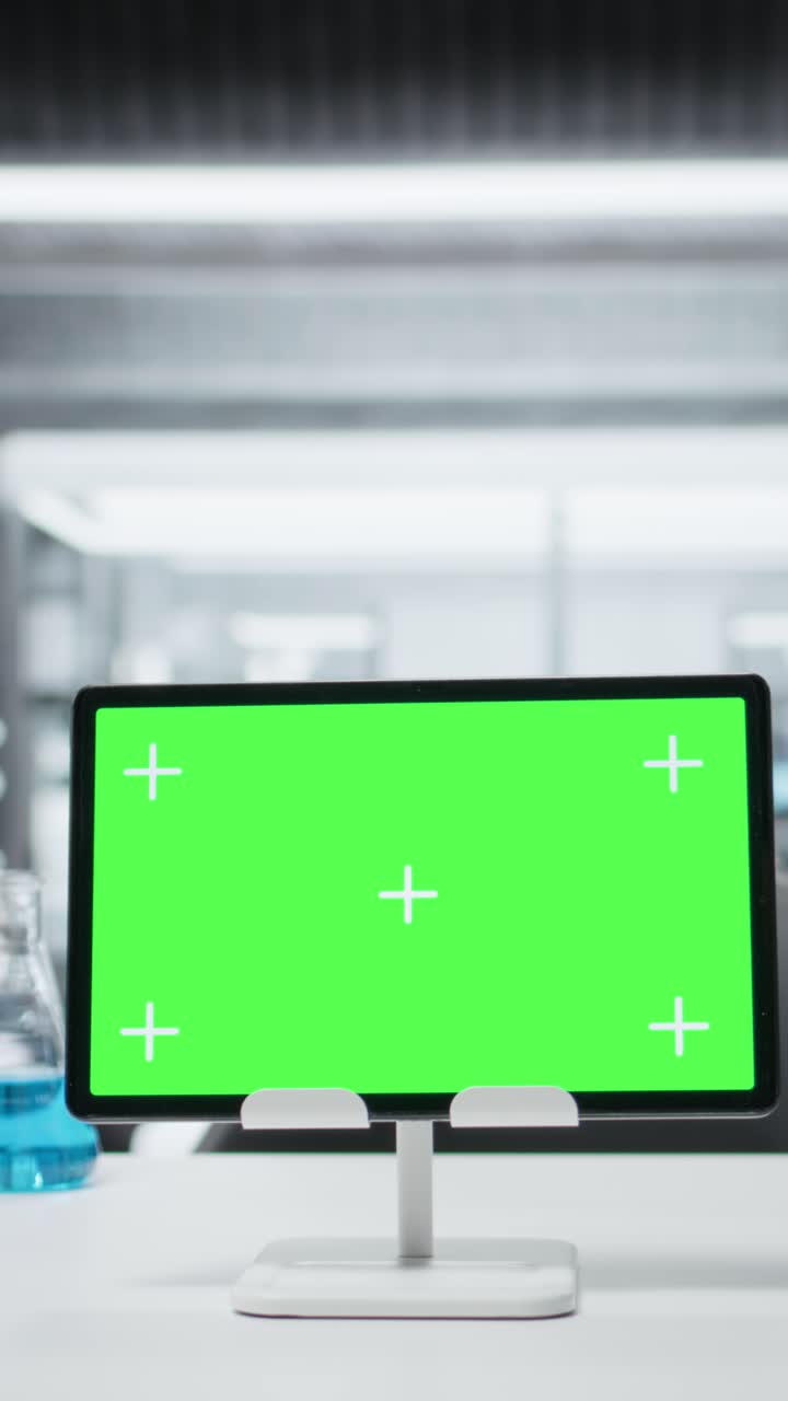Vertical video Close up of green screen tablet on workbench in empty hospital laboratory