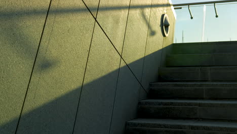 Textured-building-surface,-play-of-light-and-shadow,-urban-detail