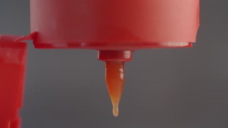 ketchup dripping from a bottle