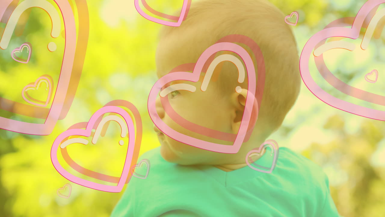 카우카시안 행복한 아기 위에 떨어지는 마음의 애니메이션