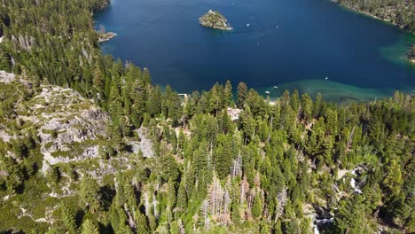 emerald bay, lake tahoe usa, revealing drone shot of landscape and fannette island on sunny day