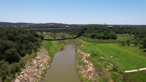 Aerial-footage-of-the-Pedernales-River-Bridge-Highway-71-in-Spicewood-Texas