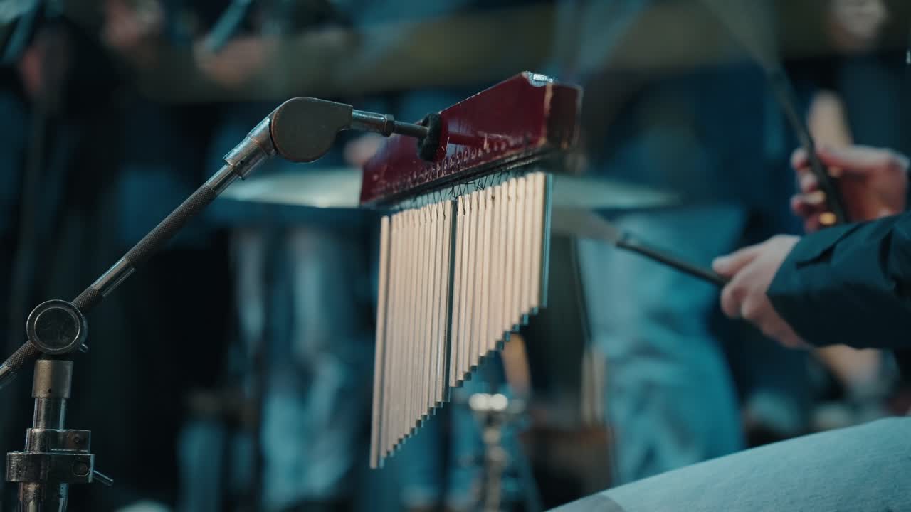 Close up of chimes during a live musical performance with a blurred background