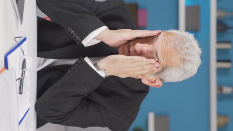 Vertical-video-of-Home-office-worker-man-has-eye-pain.