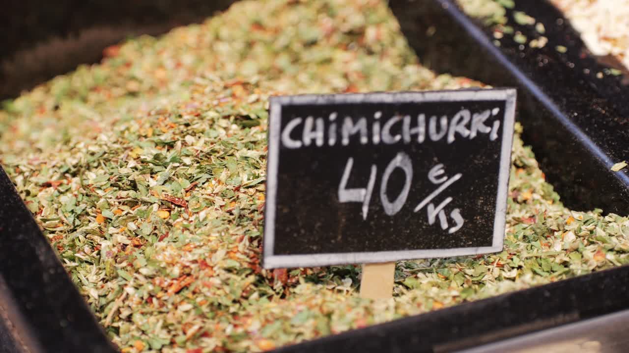Chimichurri sauce, green argentinian pesto style sauce spices, beef topping marinade, parsley and garlic sauce close up. High quality 4k footage