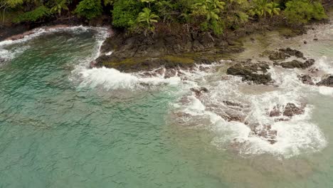 Aerial-view-above-coral-reef-ocean-exotic-Panama-island-coastline-of-jungle-palm-trees