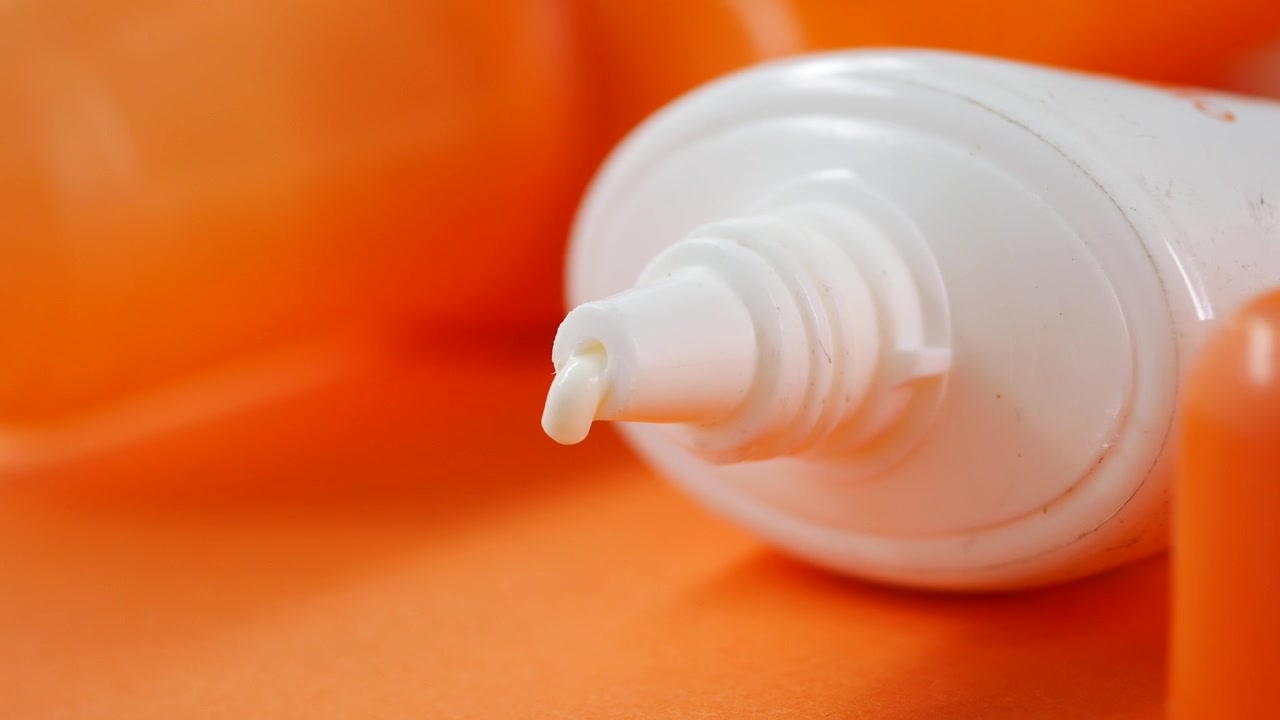 Close-up of White Cream Squeezing Out of a Tube