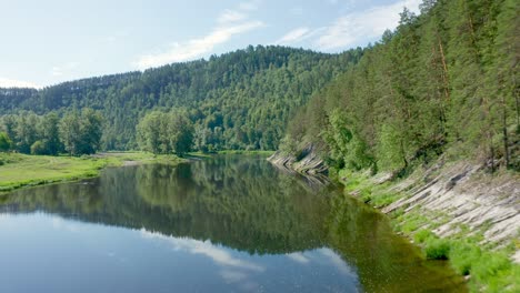 beautiful nature, trees and bushes are reflected on the surface of the water. wildlife research. the concept of tourism development in the region. the glare of the sun on the water.