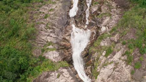 Top-aerial-view-on-mountain-cascade-waterfall