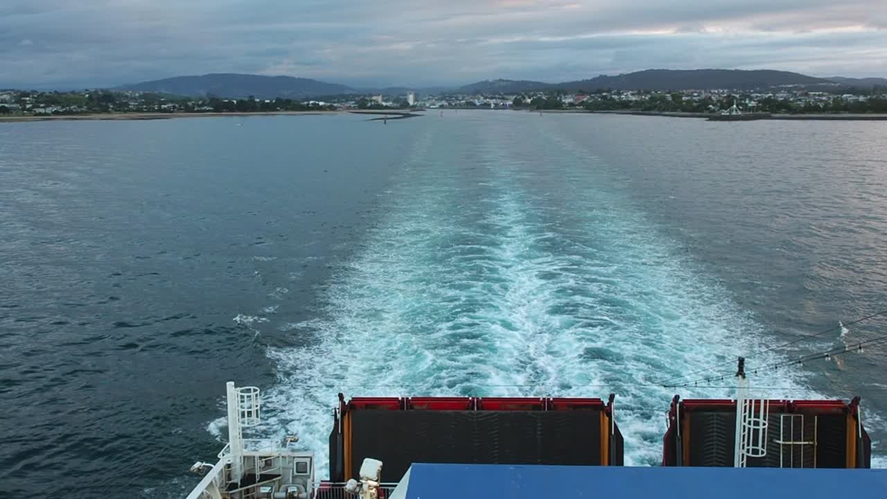 The stern of a ferry and the wake behind it