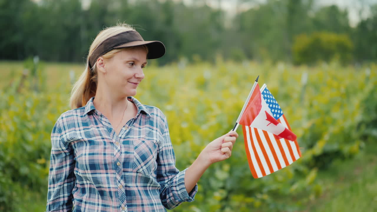 портрет фермера с флагами сша и канады в руках