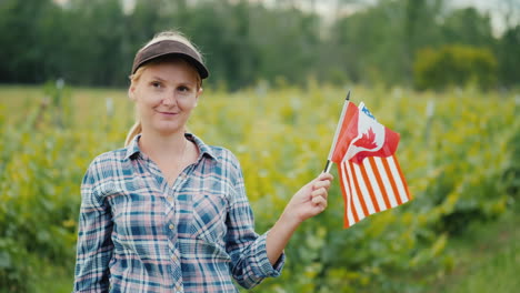 Portrait-Of-A-Farmer-With-Usa-And-Canada-Flags-In-Her-Hand