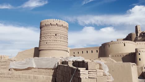 ornate tower of arg-e bam, iran under blue skies