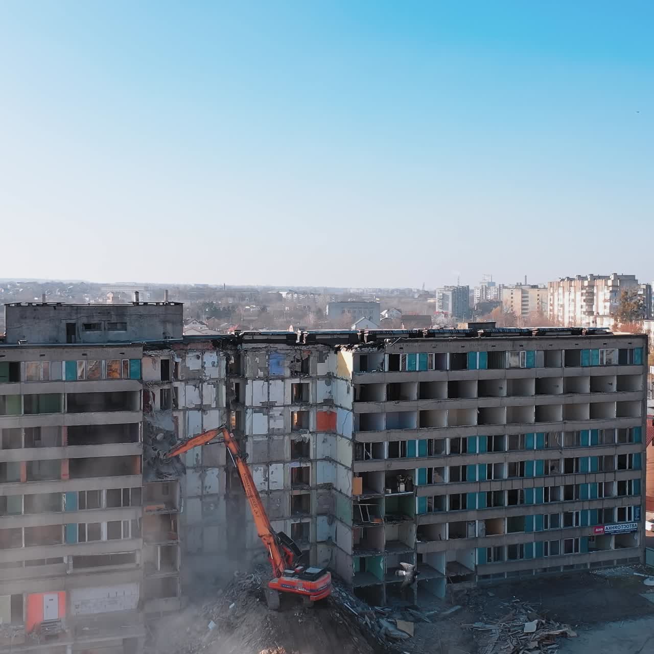 Excavator destroying building. Bulldozer constructive demolition