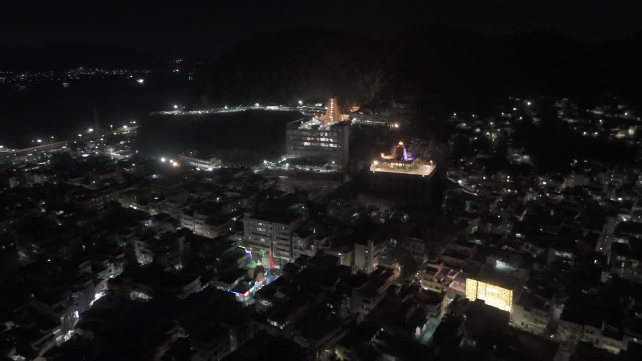 An aerial video of Kanaka Durga Temple in Vijayawada at night would offer a mesmerizing spectacle. The temple's golden gopuram, illuminated by countless lights