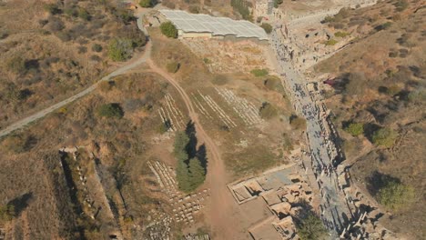 ephesus drone flight of ancient ruins of roman greek era in turkey, turkiye, visitors and tourists exploring, bird's-eye view of ephesos