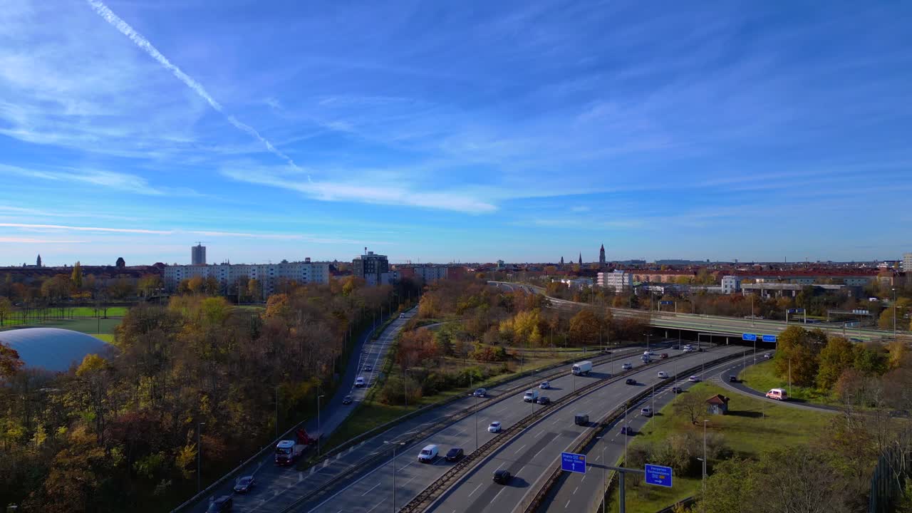 Aerial view tracking over the vast urban landscape of Berlin under a clear sky. Lovely aerial view flight ascending raise up drone