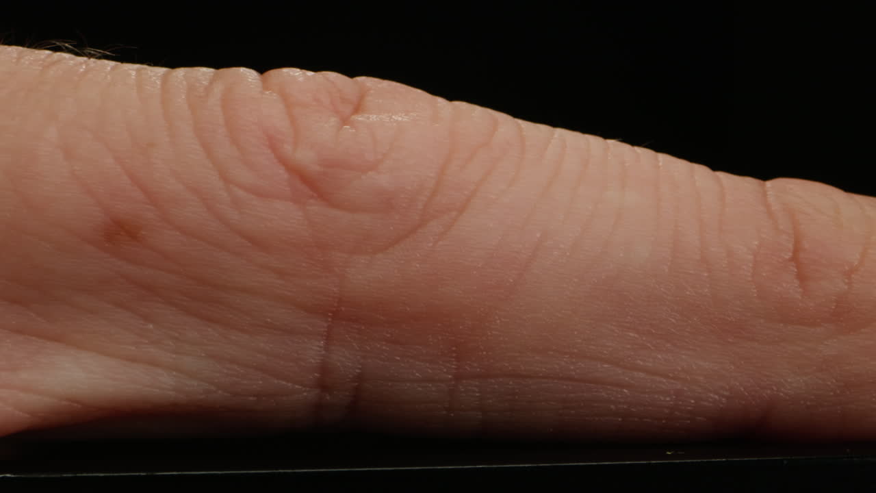 Close-up of man hand skin texture. Macro Detailed human skin, lines on hand palm.