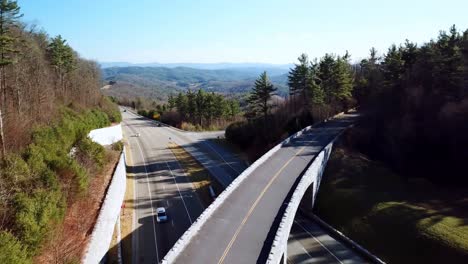 aerial pullout over blue ridge parkway bridge near boone and blowing rock nc, north carolina