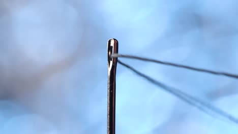 threading a needle in macro scale