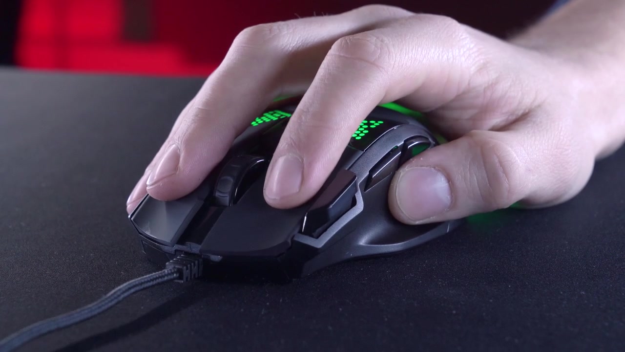 Close-up of Hand Operating a Gaming Mouse with RGB Lighting