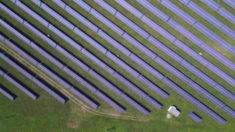 Stunning-aerial-top-view-flight-Solar-field-plant-factory-at-village-Chlum,-Czech-Republic-Summer-2023