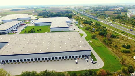 aerial view of logistics center, warehouses near the highway