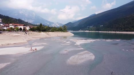 Dry-empty-lake-of-Barcis-in-Italy,-aerial-drone-fly-above-view