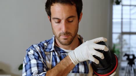 male photographer cleaning lens cover 4k